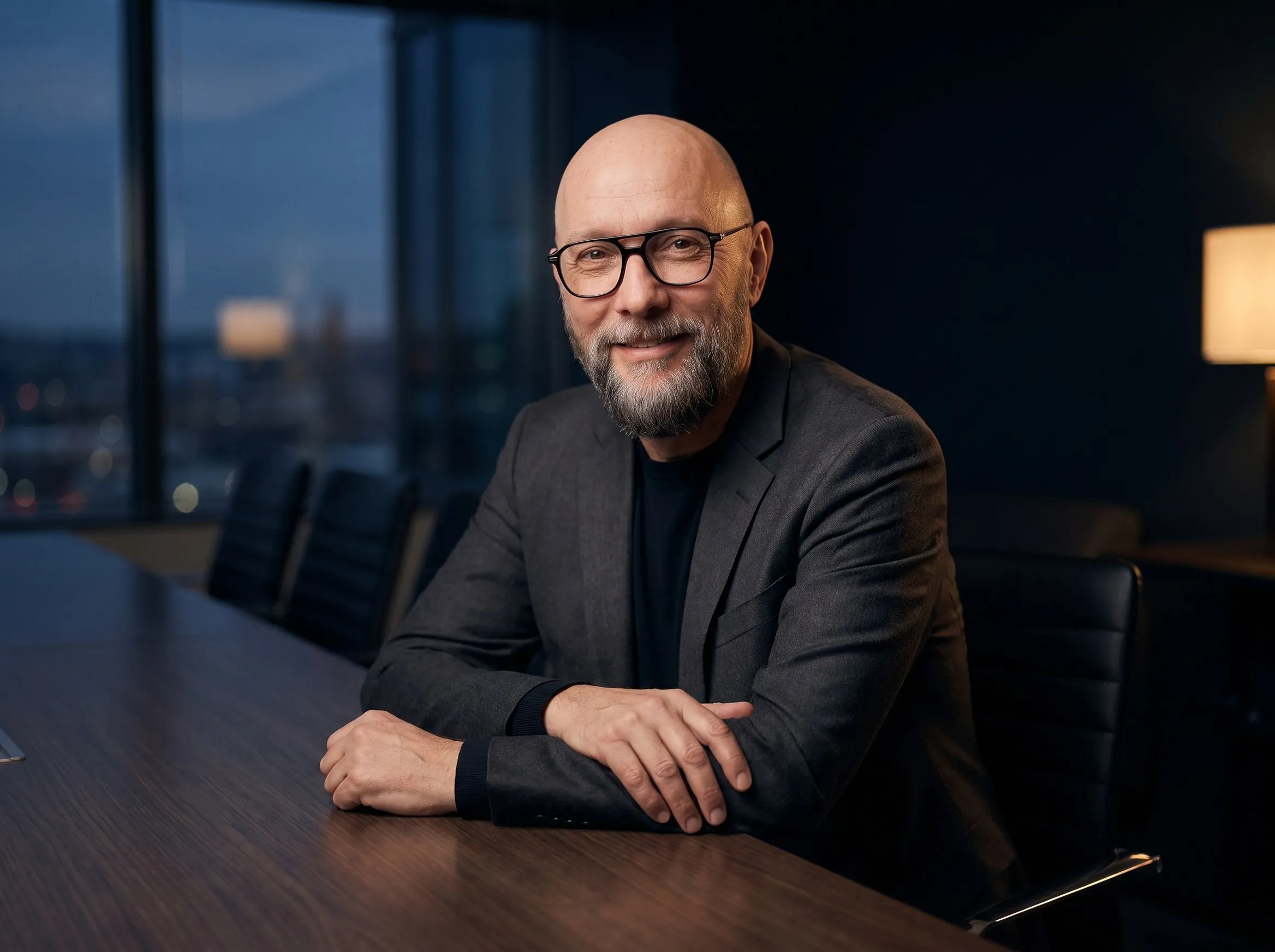 Kurt Schmidt at a conference table in an agency office